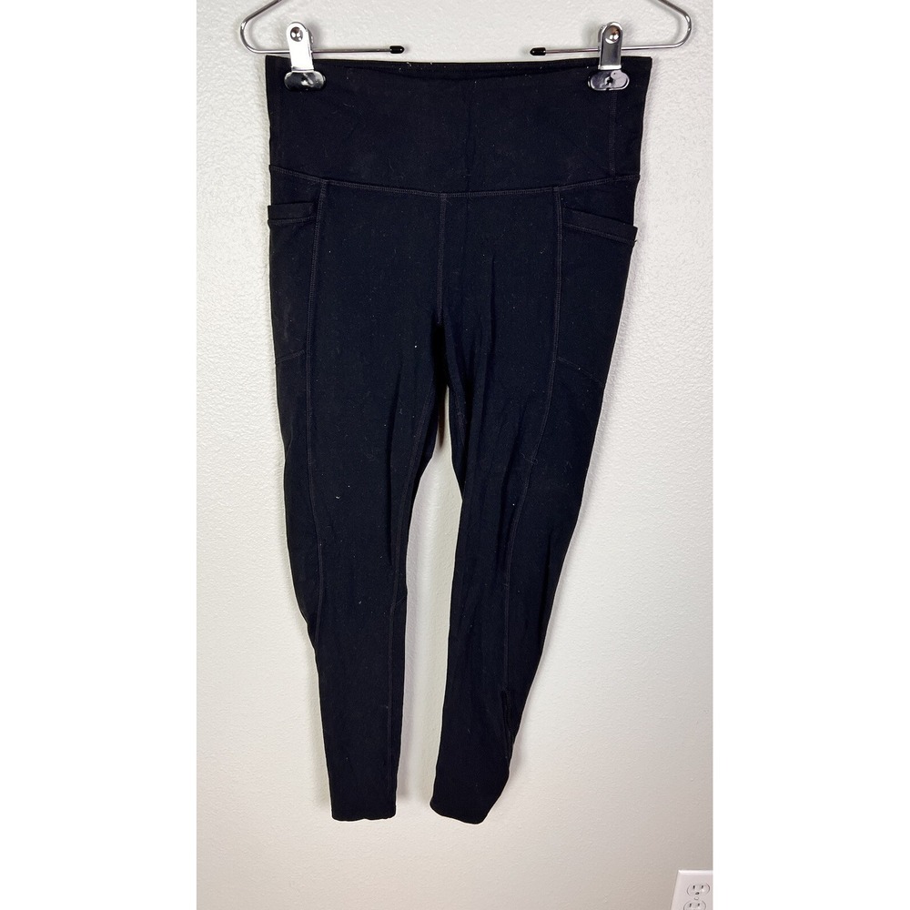 Athleta Leggings Black Zip Cuffs pockets size M 7/8 length